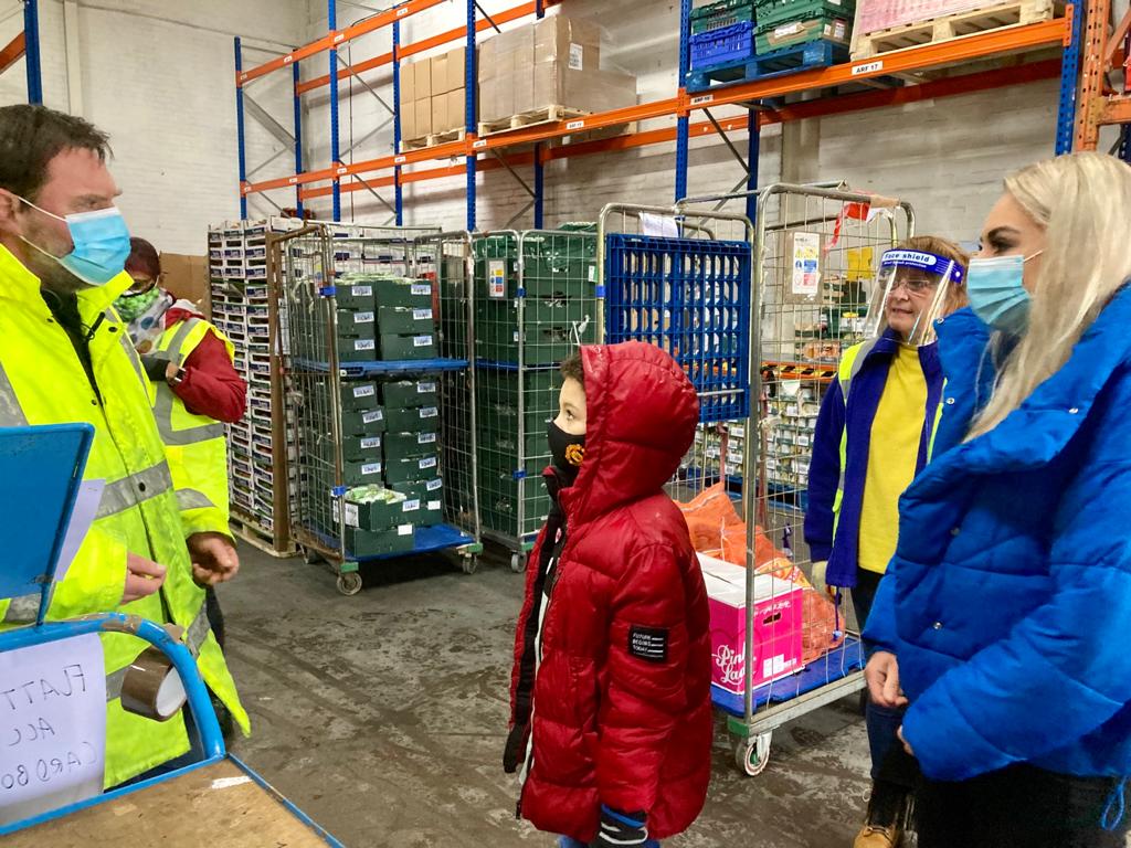 Caleb Waterhouse meets with members of the FareShare GM team