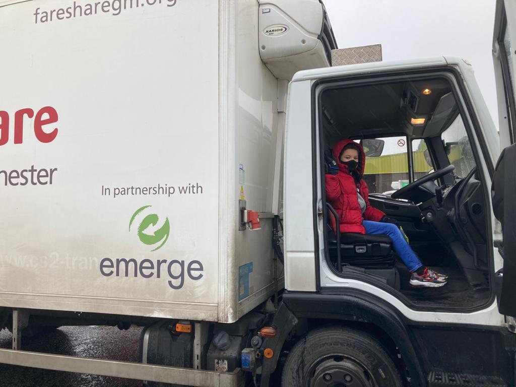 Caleb Waterhouse gets a look from inside the FareShare GM delivery van