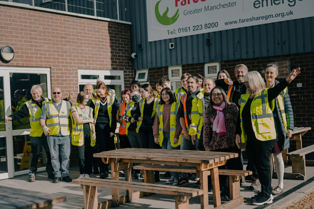 Group picture of EMERGE staff outside the building