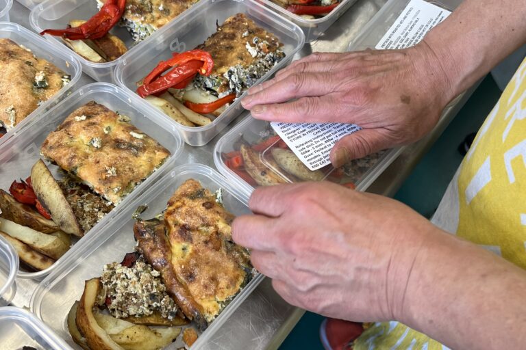 tubs of food with lids added