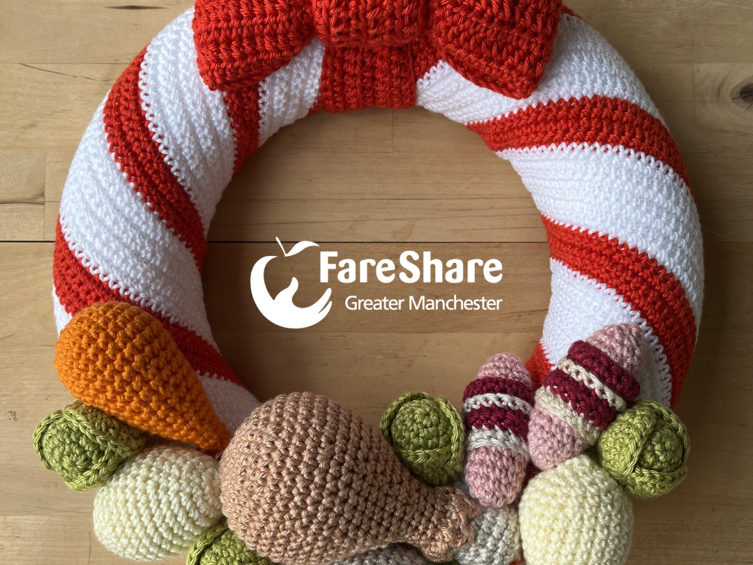 crochet fundraising wreath featuring a Christmas dinner