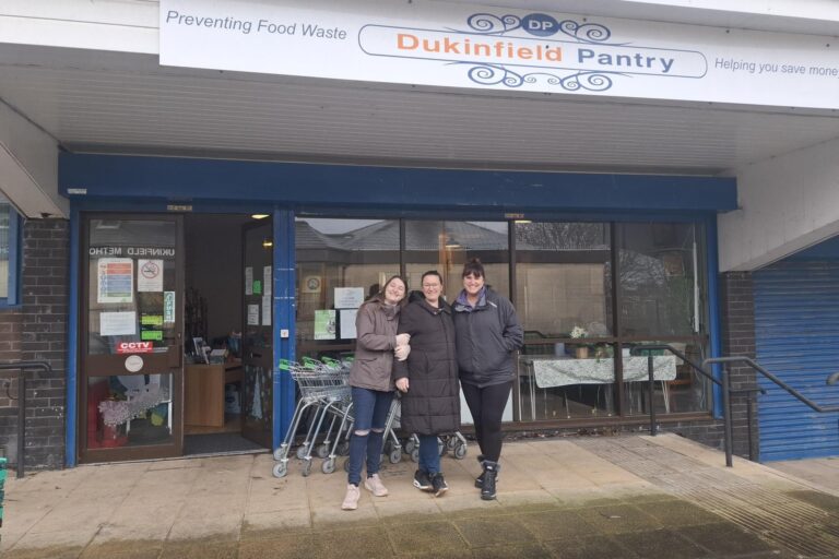 three volunteers from Dukinfield Pantry, outside the front of the building