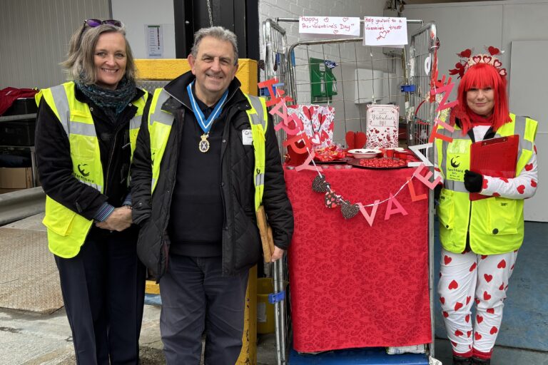 staff with FareShare Plus volunteer Sally Lamb at the Valentine's stand, FareShare Plus