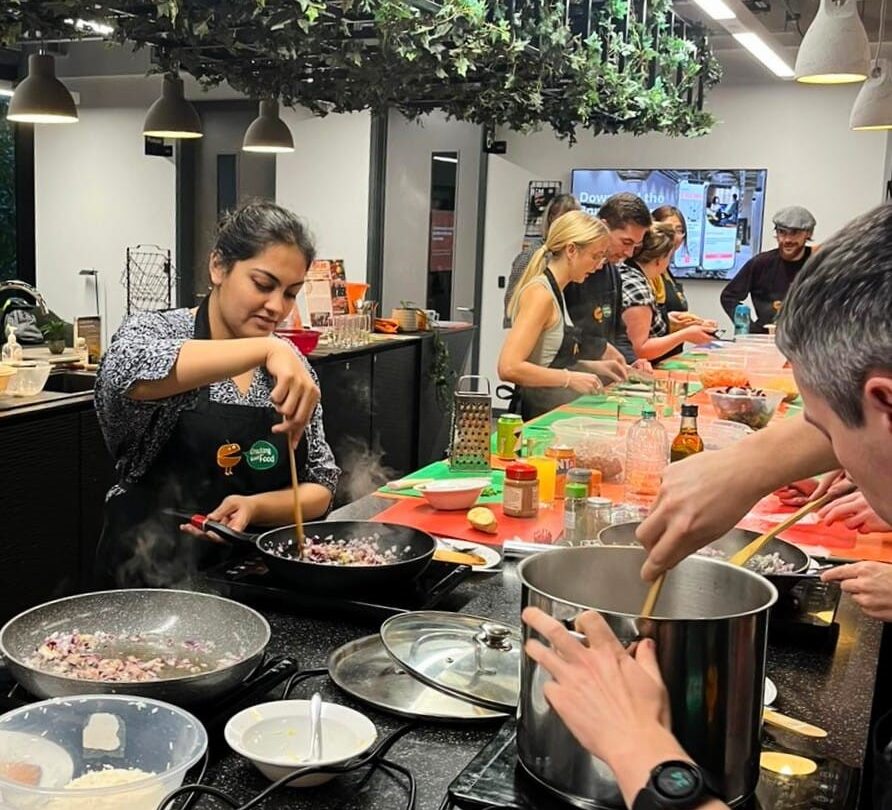 community cooking project in a large open plan restaurant kitchen